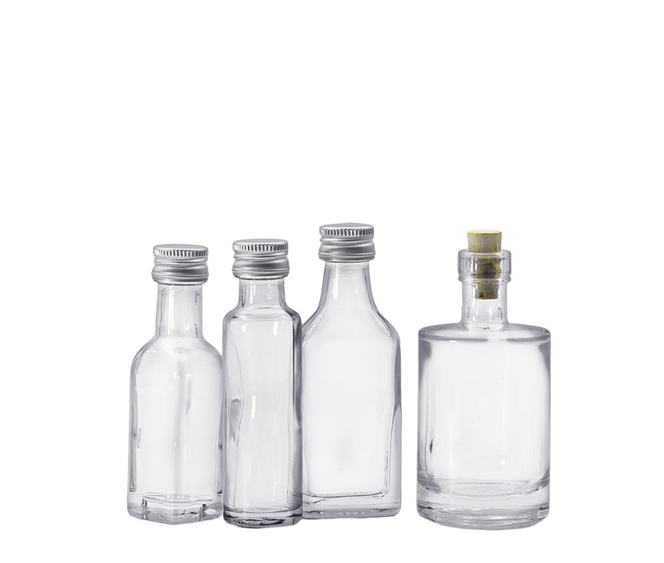 Mini Bottles Three bottles with screw caps and one with cork on a white background