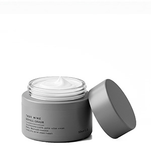 Cosmetic jar grey filled with cream