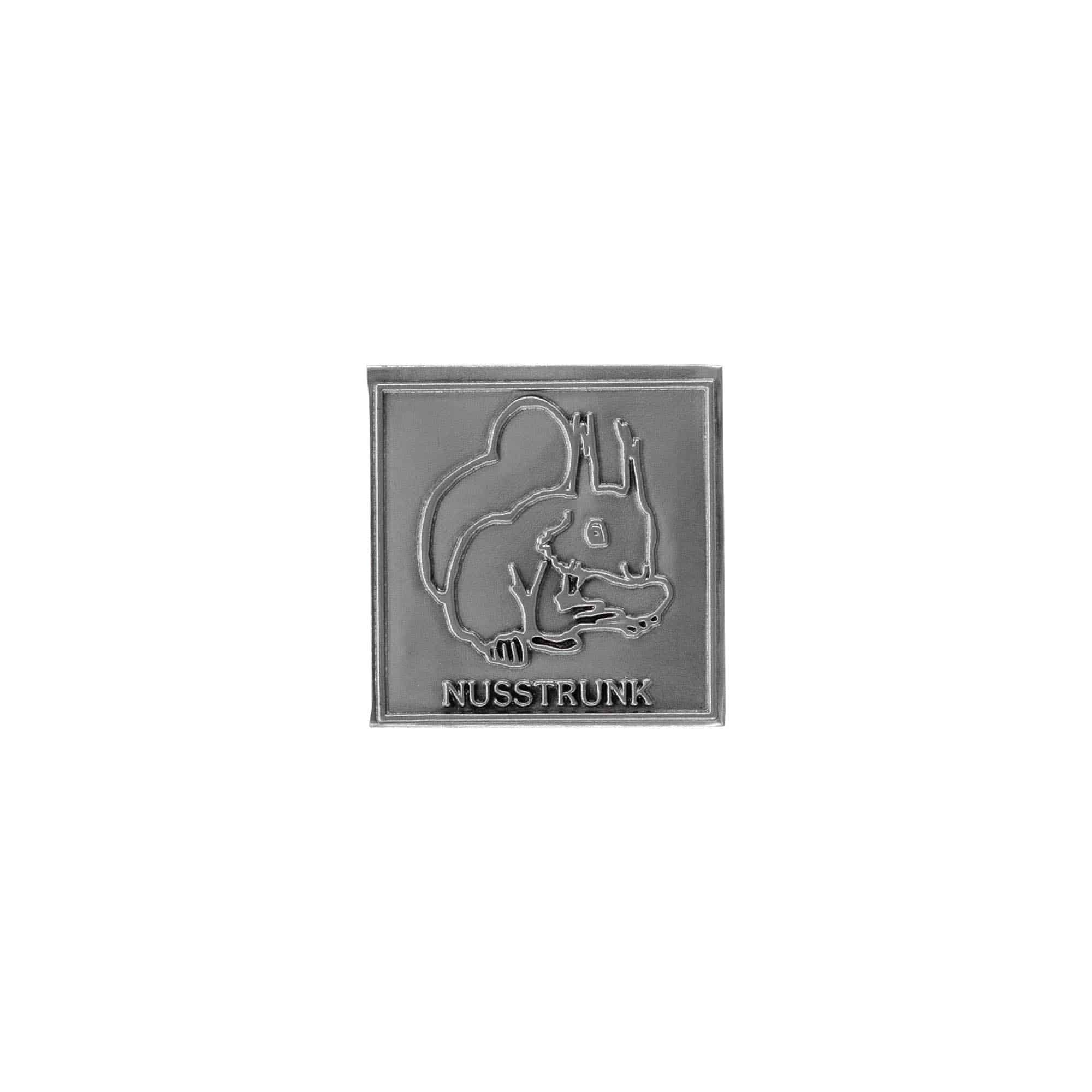 Tin label ‘Nusstrunk’, square, metal, silver